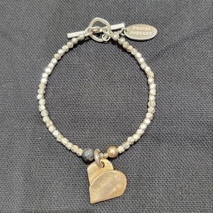 Silver bracelet with hematite  bead and bronze heart design